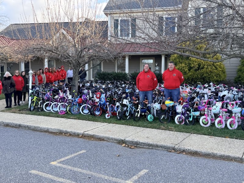 Gathered beside the collected bikes are SeaScape Property Management team members (l-r) Kelly Nichols, Andrea Story, Catherine Saenz, Hope Iannette, Patty Adamo, Heather Giardina, Beth Adams, JT Threlkeld, Linda Mazie, Lexi Giardina, Brian Aungst, Chip Poole, Neal Richard, Tim Setzer, Doug Nichols and Chris Nichols. SUBMITTED PHOTO